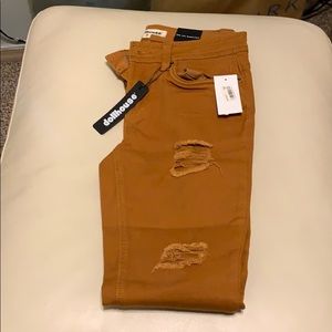 Rust colored stretch ripped jeans